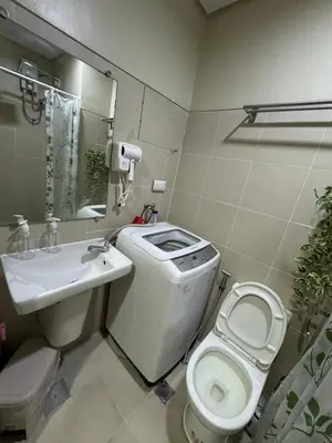 a bathroom with a toilet and a sink at Lemon Room in S Residences near MOA, Airport, US Embassy by Prime Stay in Manila