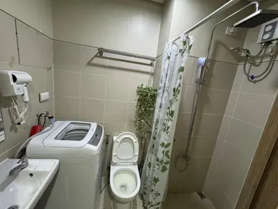 a small bathroom with a toilet and a sink at Lemon Room in S Residences near MOA, Airport, US Embassy by Prime Stay in Manila
