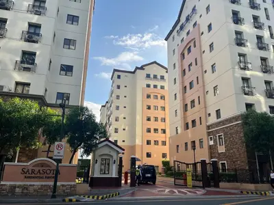 a street with two tall buildings in a city at Spacious 2 Bed & 2 Bath Condo in Newport City in Manila