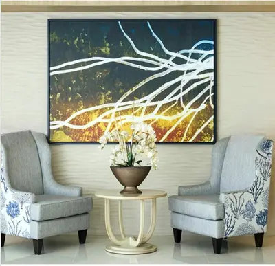 two chairs and a table in a room with a painting at Elegant Stay in Shell Residences Tower A by One Guest Place in Manila