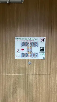 a sign on the door of a wooden door at Modern 1-BR Retreat with Pool, High Speed Wifi, Netflix, steps from MOA, Bars, Entertainment, Transport in Manila