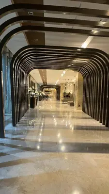 an empty hallway in a building with a hallwayngth at Modern 1-BR Retreat with Pool, High Speed Wifi, Netflix, steps from MOA, Bars, Entertainment, Transport in Manila