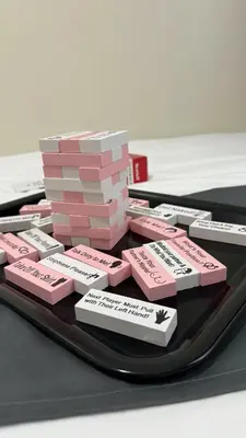 a tray with a stack of pink blocks on a table at Modern 1-BR Retreat with Pool, High Speed Wifi, Netflix, steps from MOA, Bars, Entertainment, Transport in Manila
