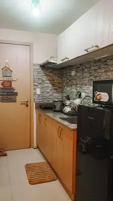 a kitchen with a sink and a counter top at My little Apartment in Manila