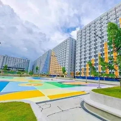 a large courtyard with a large building at 1BR with Netflix, Prime & KTV in Manila