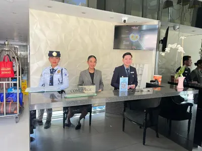 a group of three men sitting at a table at Condo Azure Urban Resort Paranaque in Manila
