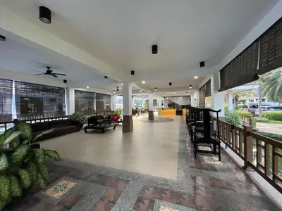 a lobby of a building with a living room at Spacious 3BR with Huge TV near BGC Makati Airport in Manila