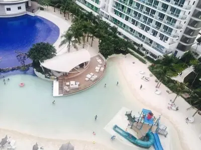 a resort with a pool and a water park at Azure Urban Resort paranaque in Manila