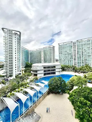 a view of a resort with a pool and buildings at Lé Boom's Staycation in Manila