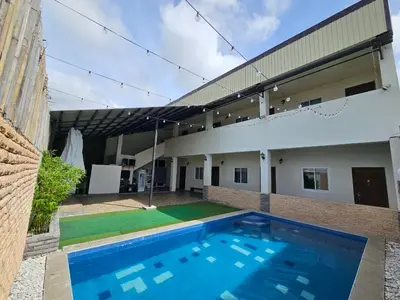 a swimming pool in front of a building at \ub098\uc774\uc2a4\uace8\ud504\ud154 \uc774\uae00\ub9bf\uc9c0\uace8\ud504\uc7a5 in General Trias