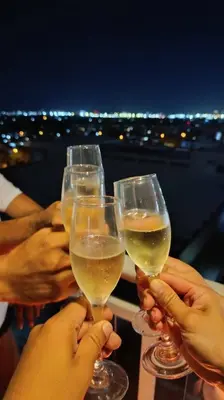a group of people holding up glasses of wine at Azure Urban Resort paranaque velvet horiyama in Manila