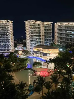a view of a city at night with tall buildings at Azure Urban Resort paranaque velvet horiyama in Manila