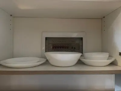 four bowls sitting on a shelf in a room at 2br Beach KTV Condo in MOA SMX Okada, Near Airport in Manila