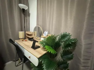 a dressing table with a mirror and a plant on it at 2br Beach KTV Condo in MOA SMX Okada, Near Airport in Manila