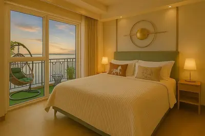 a bedroom with a large bed and a balcony at Luxurious 3BR near Solaire & Okada w Infinity Pool in Manila