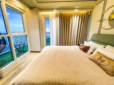 a bedroom with a large bed and a large window at Luxurious 2BR near Solaire, Okada, Airport in Manila