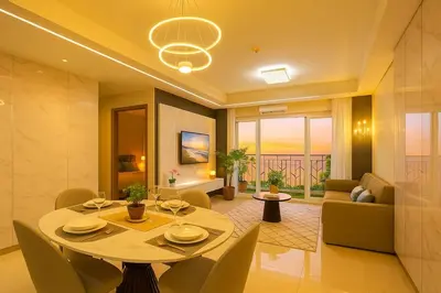 a dining room with a table and chairs and a living room at Ultra Luxury 6BR near Solaire, Okada, & Airport in Manila