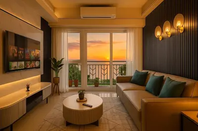 a living room with a couch and a table at Lovely & Luxury 1BR near Solaire, Okada w Sunset in Manila