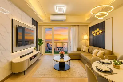 a living room with a couch and a table at Lovely & Luxury 1BR near Solaire, Okada w Sunset in Manila