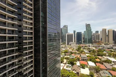 an aerial view of a city with tall buildings at 1 Bedroom Loft in Gramercy Residences Makati in Manila