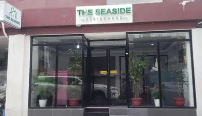 a store front with potted plants inside of it at The Seaside Residences in Manila