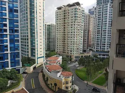 an aerial view of a city with tall buildings at Forbes Town in Manila
