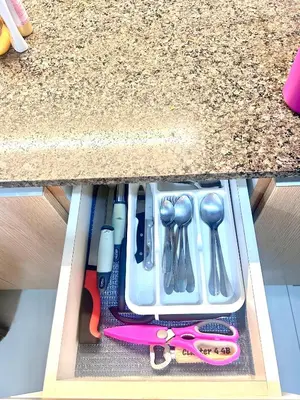a drawer filled with utensils and a pink skateboard at staycation near manila airport across NAIA terminal 3,13 min drive to terminal 2 and 1, Vexy Condotel located at 101 newport manila in Manila