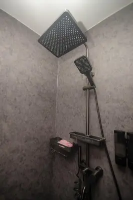 a shower with a light on the ceiling in a room at 1 Bedroom Unit at Venice Luxury Residences in Manila