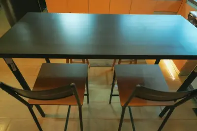 a black table with two chairs sitting at it at 1 Bedroom Unit at Venice Luxury Residences in Manila