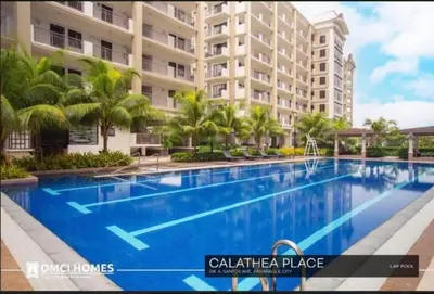 a large swimming pool in front of a building at 2BR FREE PARKING Calathea Place in Manila