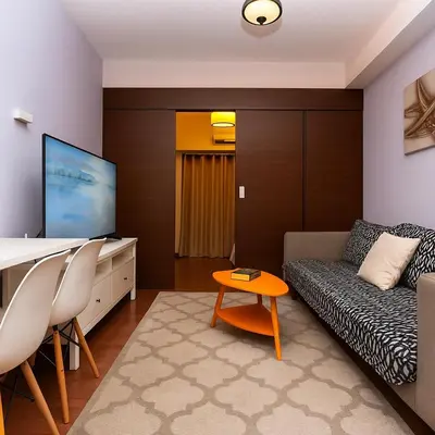 a living room with a couch and a table at Royal rise majestic Makati staycation 5338 in Manila