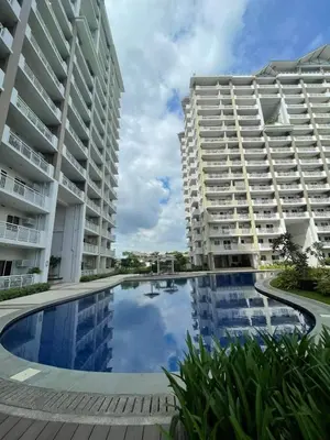 a view of two apartment buildings with a swimming pool at The Atherton by DMCI- 2BR FREE PARKING in Manila