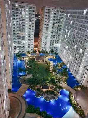 a view of a large city with tall buildings at Leisure Suite Staycation in Manila