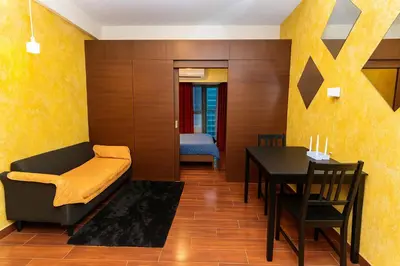 a living room with a table and a dining room at SkyVista Luxe Makati Staycation Pool Gym Netflix 5637 in Manila