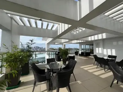 a balcony with a table and chairs on a building at Peaceful Getaway in Manila