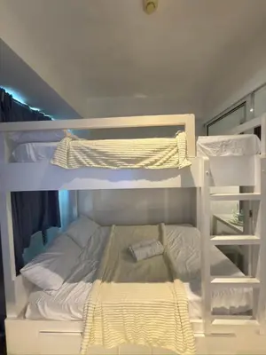 a white bunk bed in a room at Azure Residences Getaway in Manila