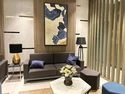 a living room with a couch and a table at The Minimal Getaway in Manila