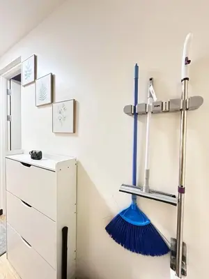 a room with a broom on the wall at Skyline Hideout in Sampong