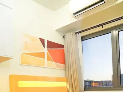 a room with a window and a painting on the wall at Awsome Corner Unit at Shore 3 in Manila