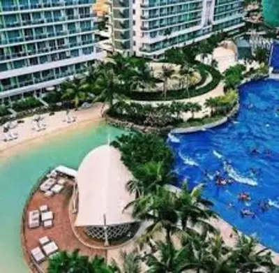 an aerial view of a resort with a swimming pool at Azure Residences Penthouse in Manila