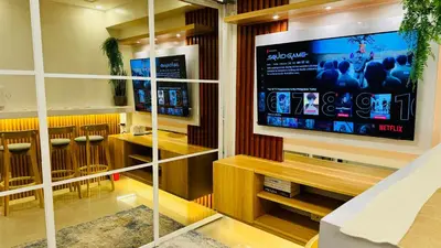 a bar with a large tv on the wall at MOA Newly Turn Over 1 bedroom with balcony PRIER Place in Manila