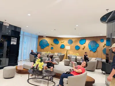 a group of people sitting in a living room at MOA Newly Turn Over 1 bedroom with balcony PRIER Place in Manila