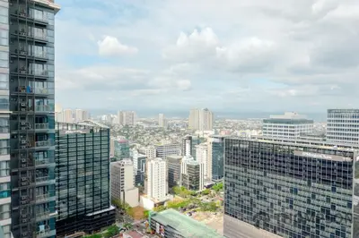 an aerial view of a city with tall buildings at Premium 2 Bedroom and 1 Living Room Suite with Balcony - One Uptown, BGC in Manila