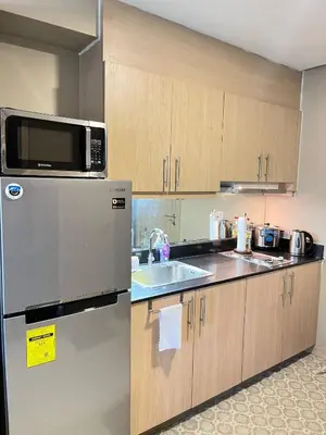 a kitchen with a refrigerator and a sink at Casa Orana in Manila