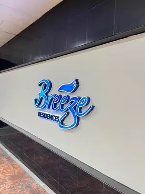 a sign on the side of a building with the brewers logo at Casa Orana in Manila