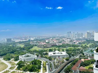 an aerial view of a city with tall buildings at The Intramuros Suite in Manila