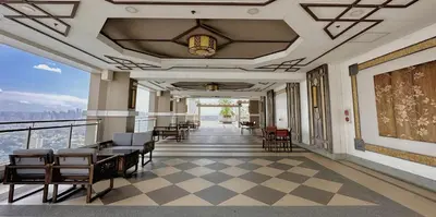 a hallway with chairs and tables in a building at The Intramuros Family Suite in Manila