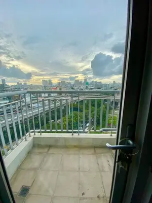 a view of a balcony with a view of a city at Casa Maria in Manila