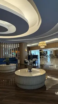 a lobby with a large room with a table in it at Dawn Haven Staycation in Manila