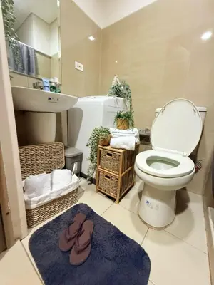a bathroom with a toilet and a sink at Near NAIA AIRPORT in Manila
